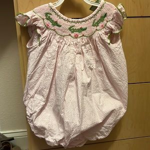 Classic Whimsy smocked alligator pink seersucker bubble suit